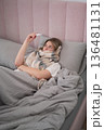 Sick Morning Wrapped in Blanket While Checking Temperature 136481131