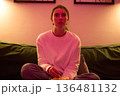 Drawn Into the Screen Under Soft Pink Lighting 136481132
