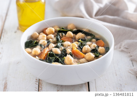Chickpea and Spinach Soup with Carrots in White Bowl Chickpea and Spinach Soup with Carrots in White Bowl 136481811