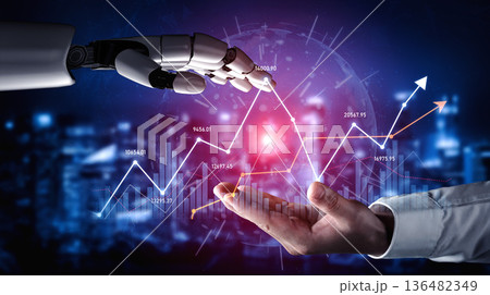 Futuristic Robot Hand Reaching Towards Human Hand with Graphical Stock Market Trends and Digital Data Visualization in Abstract Background Scalp 136482349