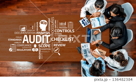 Collaborative Team Meeting for Audit Analysis, Internal Controls, Documentation, and Compliance Review on Conference Table with Charts and Laptops. Amity Collaborative Team Meeting for Audit Analysis, Internal Controls, Documentation, and Compliance Review on Conference Table with Charts and Laptops. Amity 136482384