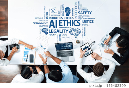 Diverse Team Collaborating on AI Ethics Issues with Charts, Data, and Technology in a Modern Office Setting. Amity Diverse Team Collaborating on AI Ethics Issues with Charts, Data, and Technology in a Modern Office Setting. Amity 136482399