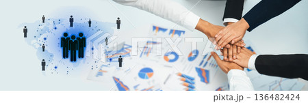 Diverse team collaboration with hands united over charts, graphs, and digital connections symbolizing teamwork, success, and data-driven strategies Trope Diverse team collaboration with hands united over charts, graphs, and digital connections symbolizing teamwork, success, and data-driven strategies Trope 136482424