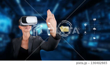 Professional Woman Using Virtual Reality Technology for Data Management and Online Business Solutions in a Modern Corporate Environment XDMCP Professional Woman Using Virtual Reality Technology for Data Management and Online Business Solutions in a Modern Corporate Environment XDMCP 136482665