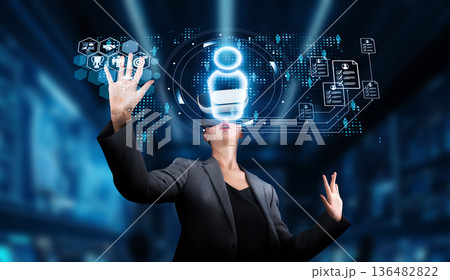 Professional woman interacting with digital interfaces for recruitment, job applications, and talent management in a modern workplace environment. XDMCP Professional woman interacting with digital interfaces for recruitment, job applications, and talent management in a modern workplace environment. XDMCP 136482822