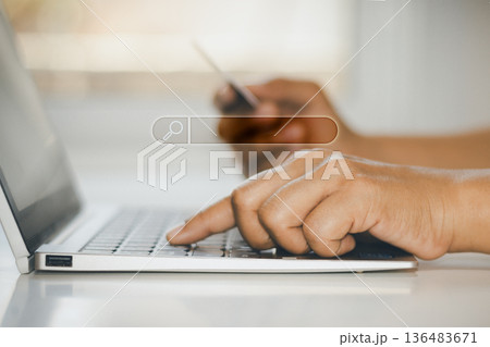 man using laptop with credit card 136483671