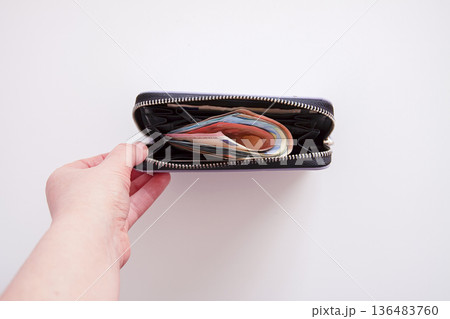 Stylish purple leather wallet with euro notes. Financial readiness and subtle luxury. 136483760