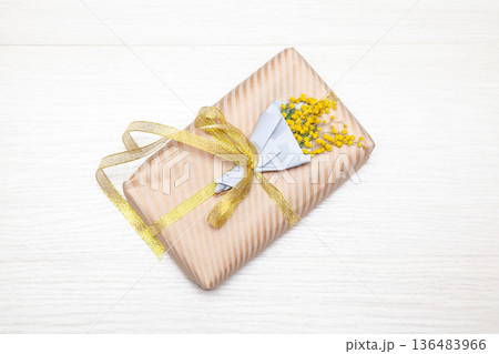 Small Gift with Mimosa Flowers Small Gift with Mimosa Flowers 136483966