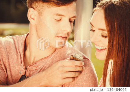 Couple on date with cupcake. Couple on date with cupcake. 136484065