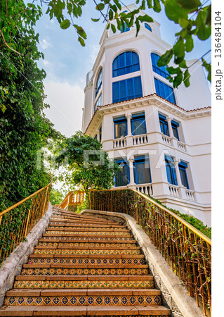 Ornate Tiled Staircase Leading to Mediterranean Villa 136484104