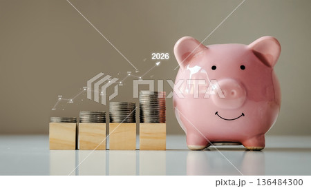 Close-up of person putting coin into pink piggy bank for saving money, financial planning, investment, and future retirement concept. 136484300