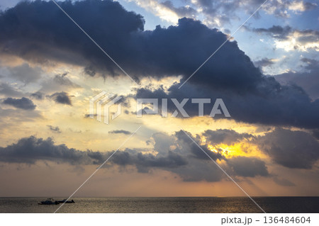 The sky is at dawn. The sky over the Indian Ocean at dawn. 136484604