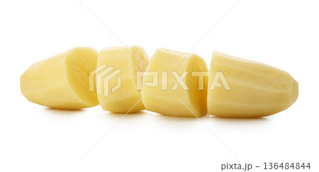Raw potatoes cut into pieces isolated on a white background 136484844