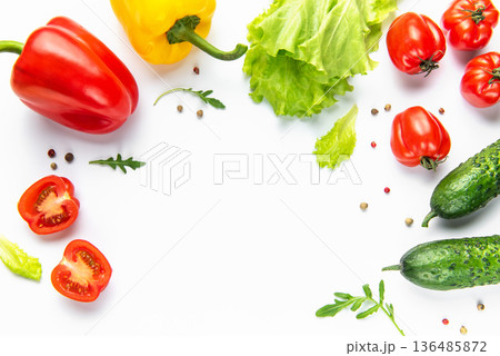 Fresh vegetables forming a nutritional food frame on white 136485872