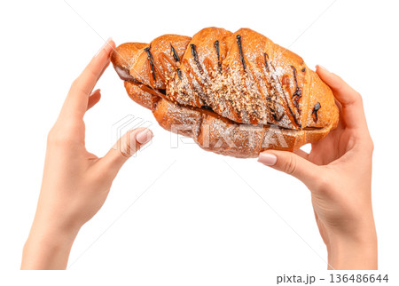 Woman holding chocolate and caramel croissant isolated on white background Woman holding chocolate and caramel croissant isolated on white background 136486644