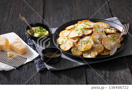 Roasted Potato Slices with Parmesan Cheese Top View Roasted Potato Slices with Parmesan Cheese Top View 136486722