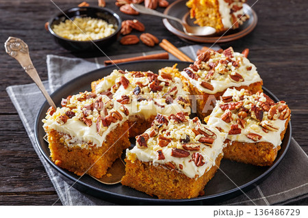Carrot cake squares with cream cheese and pecan Carrot cake squares with cream cheese and pecan 136486729
