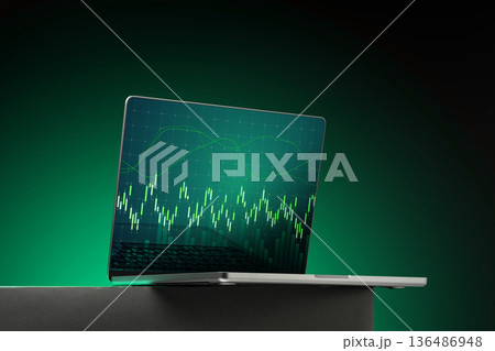 Laptop displays financial data analysis with green background and graph on screen Laptop displays financial data analysis with green background and graph on screen 136486948