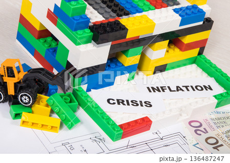 House under construction made of toy blocks, polish currency money, housing plan House under construction made of toy blocks, polish currency money, housing plan 136487247