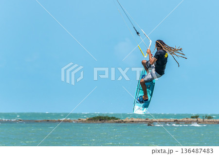 Barra Grande, Brazil - Jan 22, 2026: Kite surfing at Barra Grande beach on the coast of Piaui, northeastern Brazil. Barra Grande, Brazil - Jan 22, 2026: Kite surfing at Barra Grande beach on the coast of Piaui, northeastern Brazil. 136487483