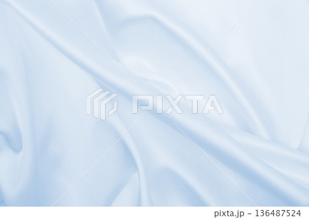 Smooth elegant blue silk or satin luxury cloth texture as abstract background. Luxurious background design 136487524