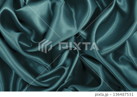 Smooth elegant blue silk or satin luxury cloth texture as abstract background. Luxurious background design Smooth elegant blue silk or satin luxury cloth texture as abstract background. Luxurious background design 136487531