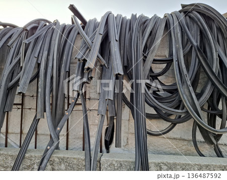 Sealing rubber for car doors. Door weatherstrips - seals installed on car doors Sealing rubber for car doors. Door weatherstrips - seals installed on car doors 136487592