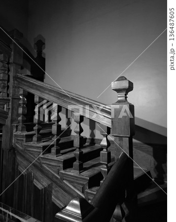 The mansion staircase is hidden in gloom, black-and-white photo The mansion staircase is hidden in gloom, black-and-white photo 136487605