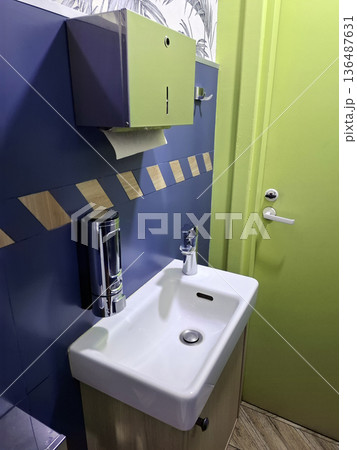 Clean restaurant restroom interior with sink Clean restaurant restroom interior with sink 136487631