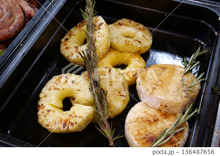 Pineapples cutted rings and little fried Pineapples cutted rings and little fried 136487656