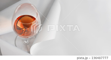 Rose Wine Glass on Minimal White Background. Elegant Modern Beverage Concept Rose Wine Glass on Minimal White Background. Elegant Modern Beverage Concept 136487777