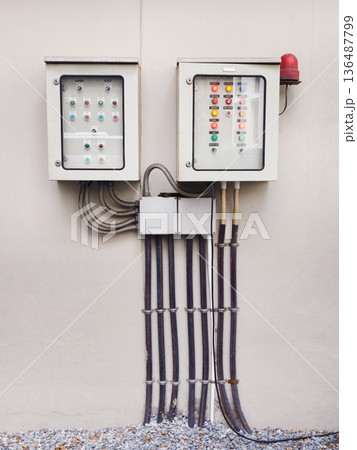The electrical control panel on the wall 136487799