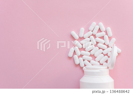 Much medical pills and drugs in white package on the pink background. Healthcare concept. Space for text. Much medical pills and drugs in white package on the pink background. Healthcare concept. Space for text. 136488642