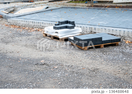 Pavement tiles for road sidewalk repair. Construction process and urban infrastructure in big city. 136488648