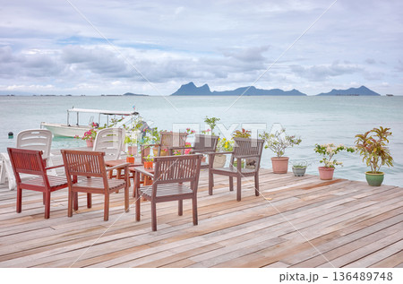 Wooden platform with seats by the sea, holiday relaxation concept, Borneo, Malaysia. 136489748