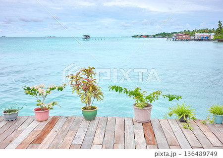 Wooden platform by the sea, holiday relaxation concept, Borneo, Malaysia. Wooden platform by the sea, holiday relaxation concept, Borneo, Malaysia. 136489749