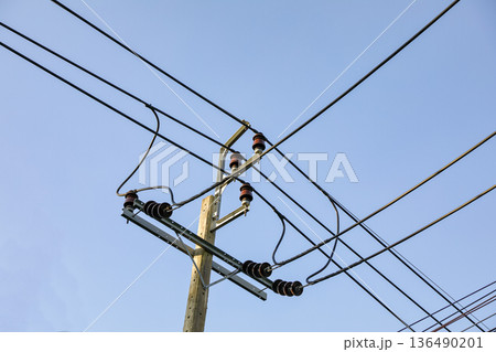 The high voltage electric pole, The electric post show with high voltage construction and power lines, beautiful blue sky background 136490201