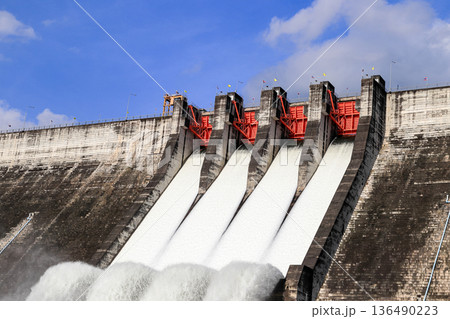 Water spill from spillway of Khun Dan Prakan Chon Dam. The biggest Roller compacted concrete dam, Nakhon Nayok thailand. 136490223