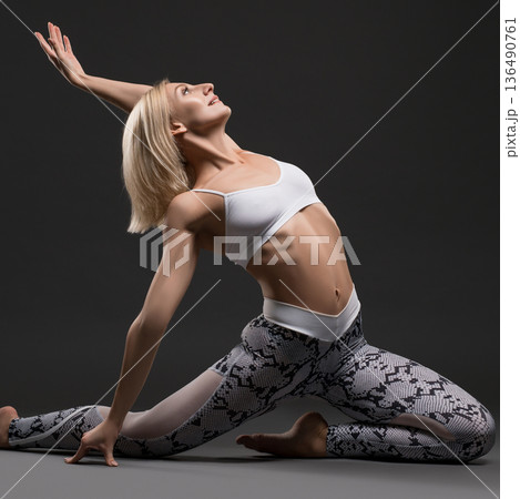 Slim blonde in a split profile shot 136490761