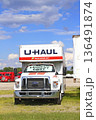 UHAUL MOVING Truck with blue sky and white clouds outdoor in a parking lot UHAUL MOVING Truck with blue sky and white clouds outdoor in a parking lot 136491874