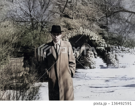 An antique portrait of a man in front of the entrance to the pump room in Kislovodsk. Retro photo, USSR, 1962. An antique portrait of a man in front of the entrance to the pump room in Kislovodsk. Retro photo, USSR, 1962. 136492591