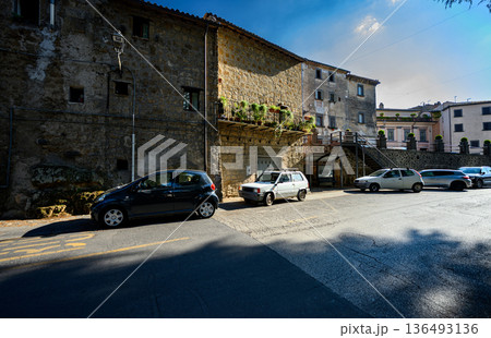 Urban landscape of Bagnoregio in central Italy, featuring historic architecture, narrow spatial composition, and a timeless Mediterranean atmosphere. Urban landscape of Bagnoregio in central Italy, featuring historic architecture, narrow spatial composition, and a timeless Mediterranean atmosphere. 136493136