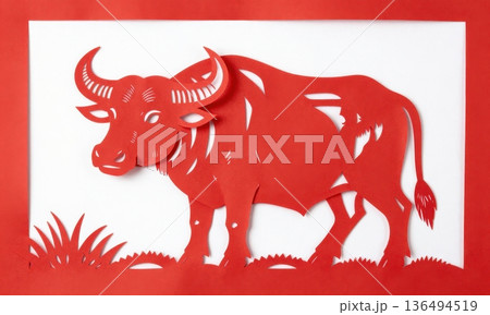 Traditional Chinese Red Paper Cut Art of Majestic Zodiac Ox with Horns and Grass. 136494519