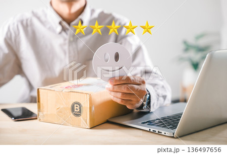 Customer experience shows positive satisfaction, happy customer gives five star review feedback for online shopping delivery box service, representing excellent product reputation concept Customer experience shows positive satisfaction, happy customer gives five star review feedback for online shopping delivery box service, representing excellent product reputation concept 136497656
