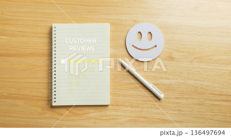 Feedback collection for customer satisfaction survey, showing five star review rating on notebook, happy face icon, pen on wood table, representing excellent service experience and quality assessment Feedback collection for customer satisfaction survey, showing five star review rating on notebook, happy face icon, pen on wood table, representing excellent service experience and quality assessment 136497694