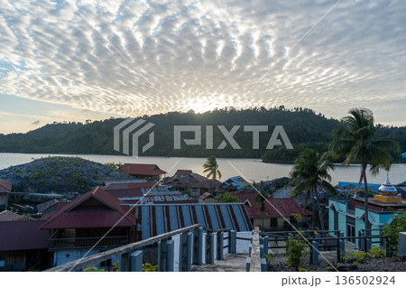 Bajo fishermen village of Pulau Papan Malenge Sulawesi Indonesia at sunset Bajo fishermen village of Pulau Papan Malenge Sulawesi Indonesia at sunset 136502924