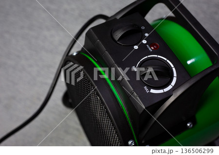 Raise temperature in your home for comfort. Temperature controller and operating mode selection for apartment floor heater. Solution for home heating problems. Increasing temperature 136506299