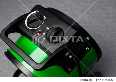 Air heater control panel. Compact space heating device. Select the temperature and operating mode for heating the air. Warming your home with room heater 136506300