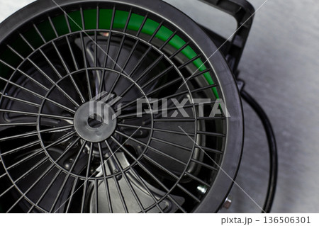 Rear panel of fan assisted air heater. Components for hot air flow. Close up photo of fan floor heater components. Device for increasing room temperature 136506301