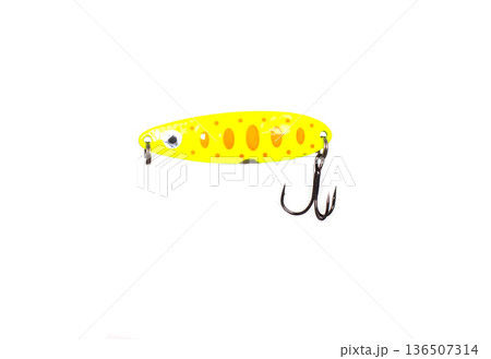 Yellow fishing spoon bait for sport fishing hobby isolated on white background. Metal artificial lure with orange spots and treble hook. Yellow fishing spoon bait for sport fishing hobby isolated on white background. Metal artificial lure with orange spots and treble hook. 136507314